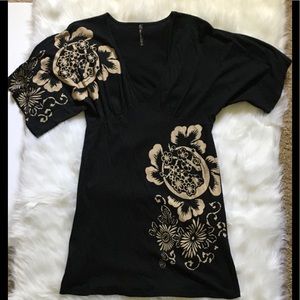 Black mini dress with beige floral print